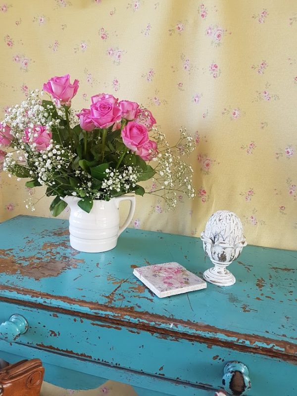 Little pink roses on yellow linen Fabric behind an old blue desk by Rose and Foxgloves