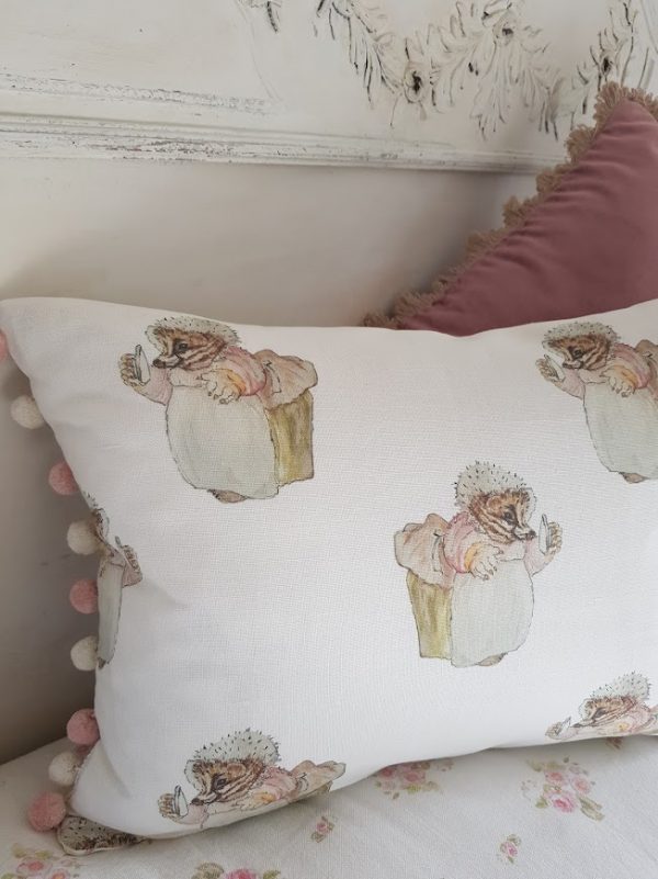 Mrs Tiggywinkle Bolster cushion with Pompom trom and pink polka dot reverse by Rose and Foxgloves