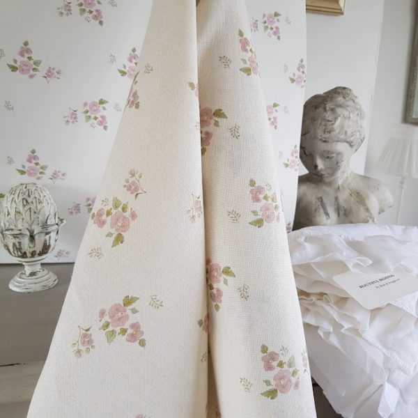 A delicate French design of little pink flowers on an Ivory base linen.